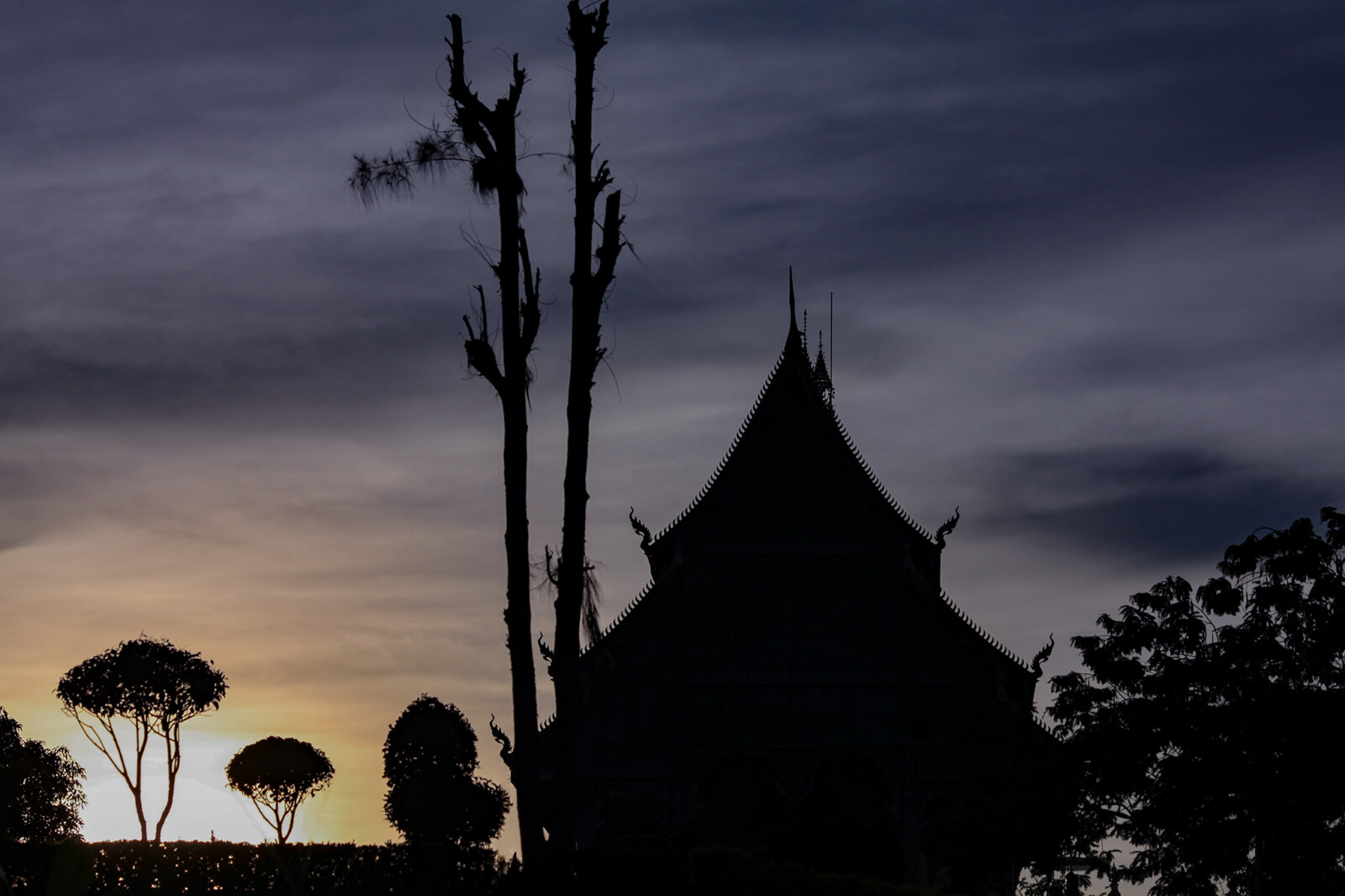 wat in silhouette at sunset